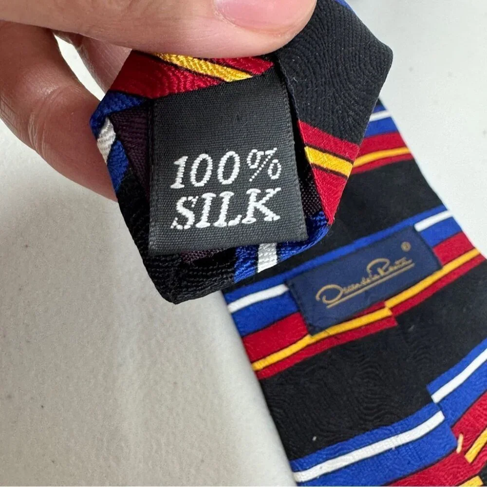 VTG Oscar de la Renta Striped Black Tie with Red and Blue Accents Textured